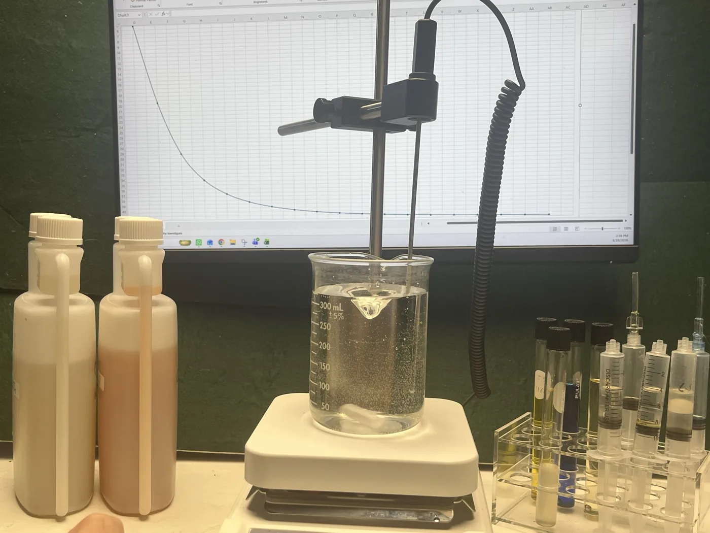 Formulation bench with samples and a stirring hot plate in the Proxima research laboratory