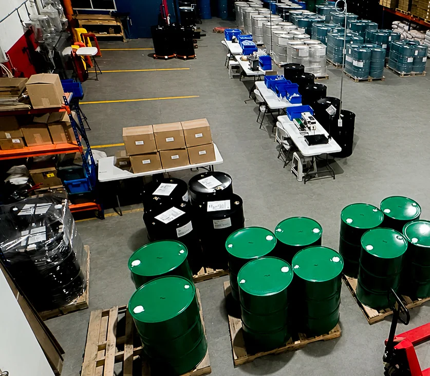 Overhead view of the Proxima warehouse with palletized drums staged for shipment